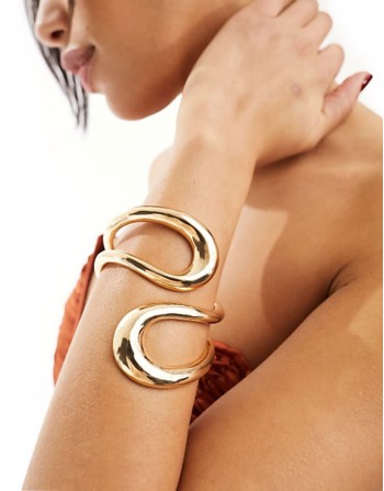 cuff bracelet with wrap around open design in gold tone