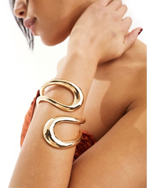 cuff bracelet with wrap around open design in gold tone