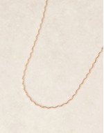 short necklace with wiggle design in gold tone