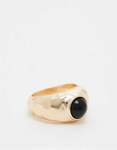 ring with molten black stone detail in gold tone