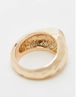 ring with molten black stone detail in gold tone