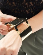 cuff bracelet with thread through detail in gold tone
